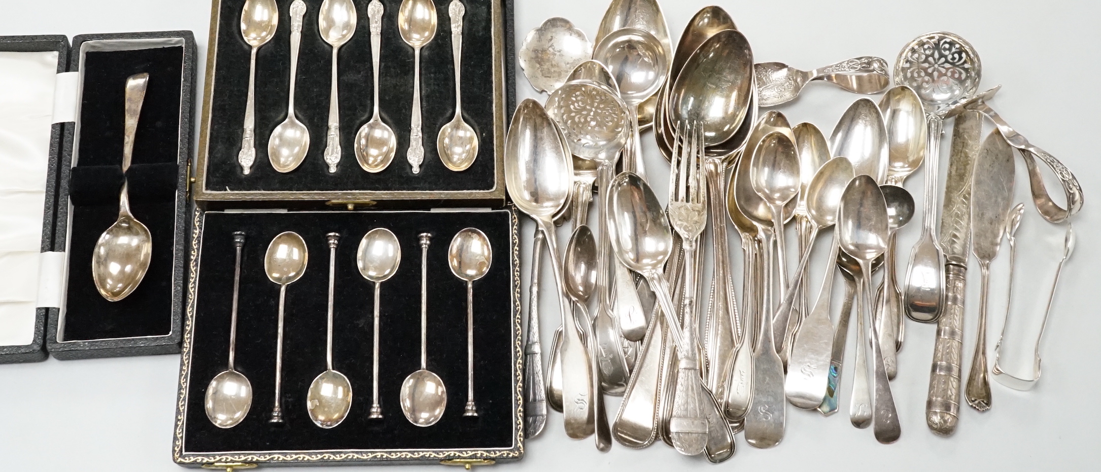 A quantity of assorted mainly 19th century and later silver flatware, various date and makers including three cased sets, 37.5oz.